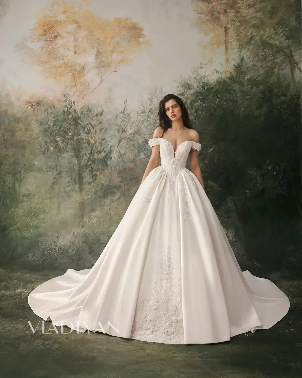 model is wearing an off the shoulder ball gown wedding dress