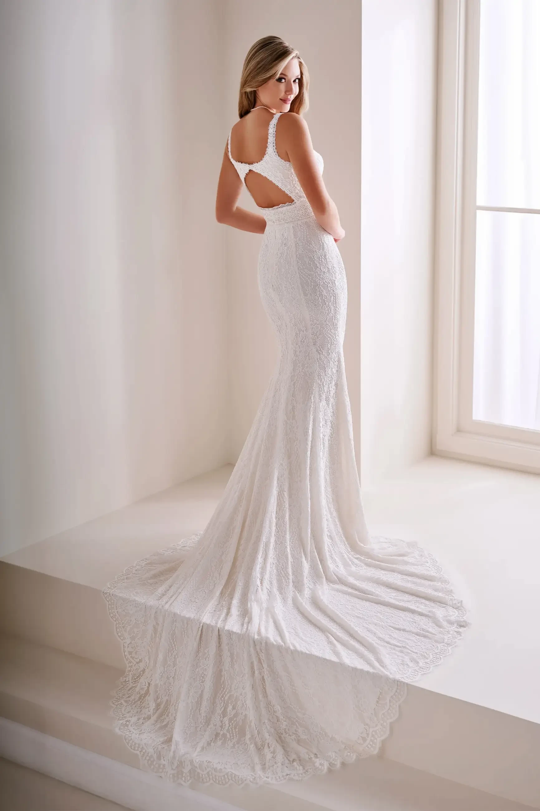 model is wearing an ivory sleeveless bridal gown