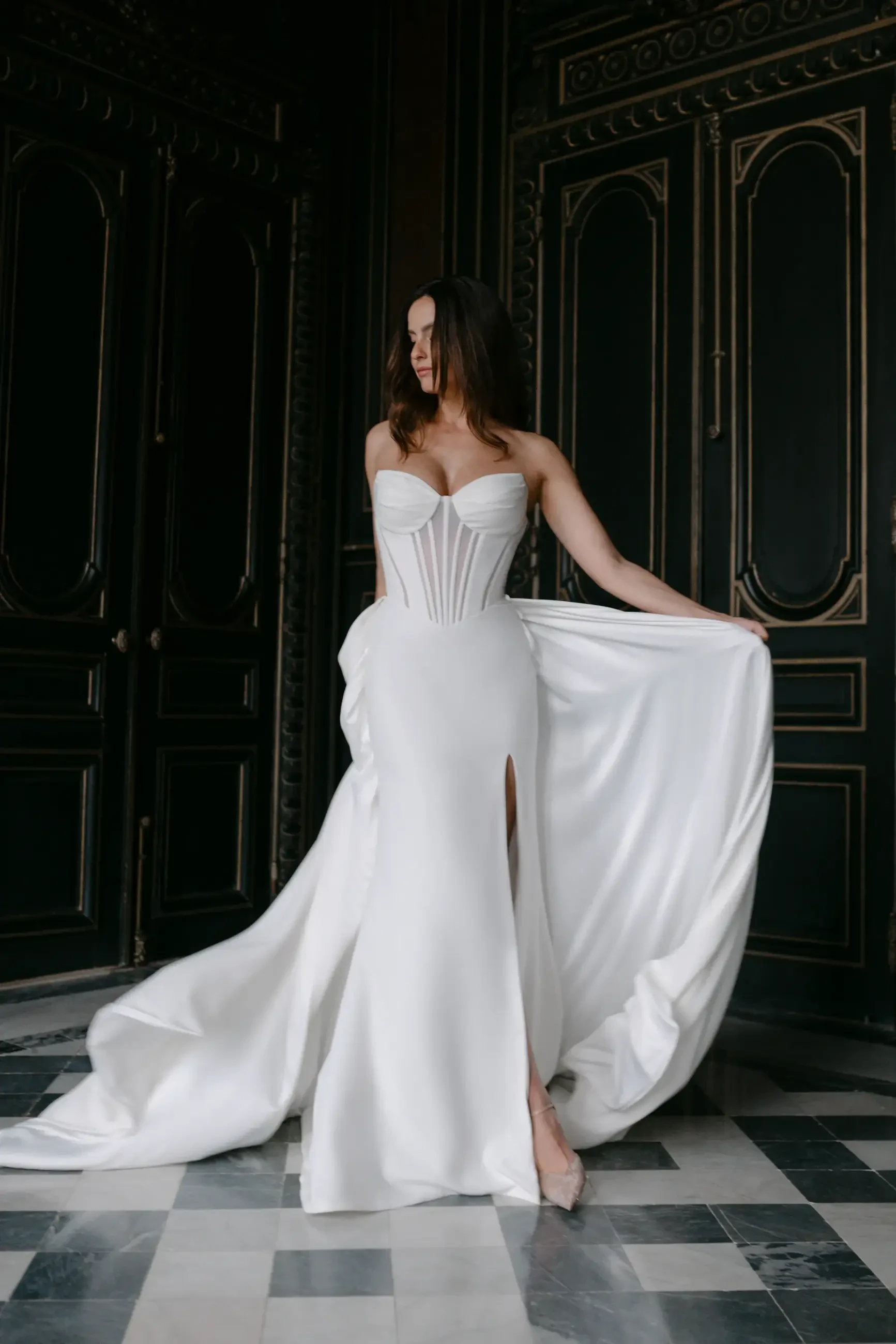 model is wearing a strapless a-line bridal gown