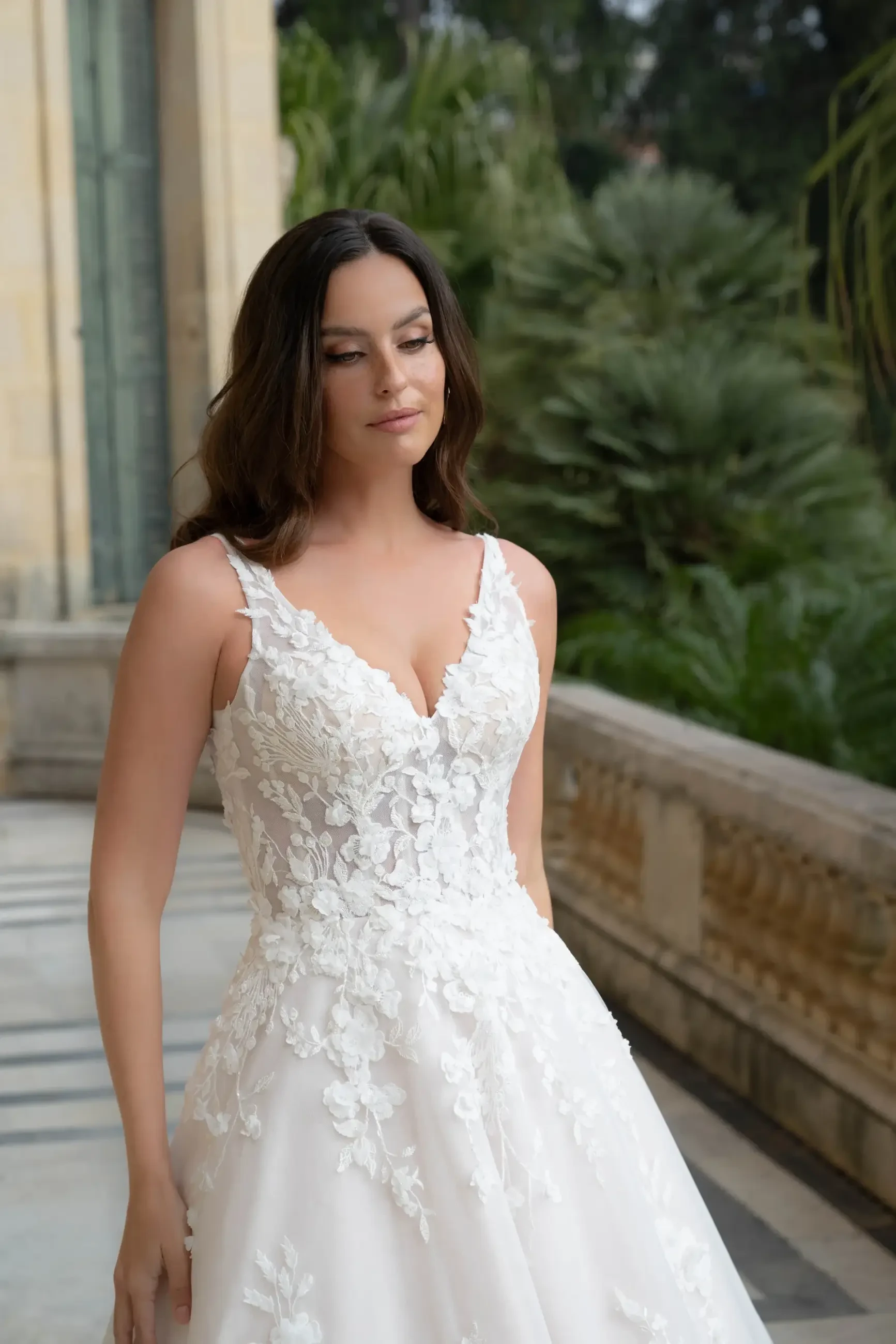 model is wearing a sleeveless a-line wedding dress