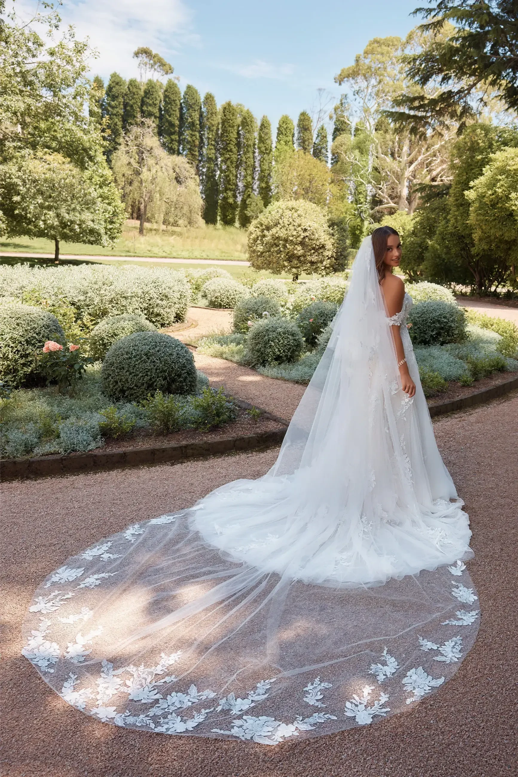 model is wearing a long bridal veil